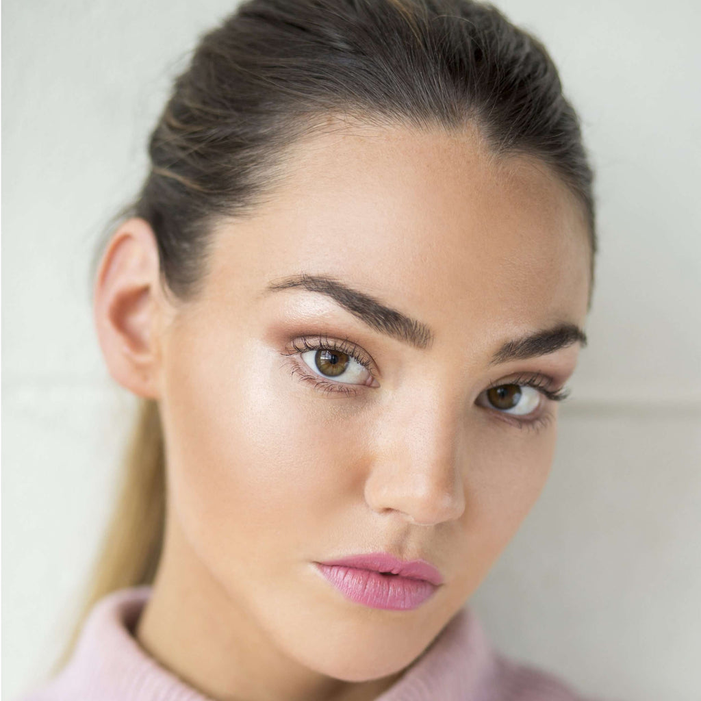 Model wearing Lou Lou Lips Flora pink lipstick